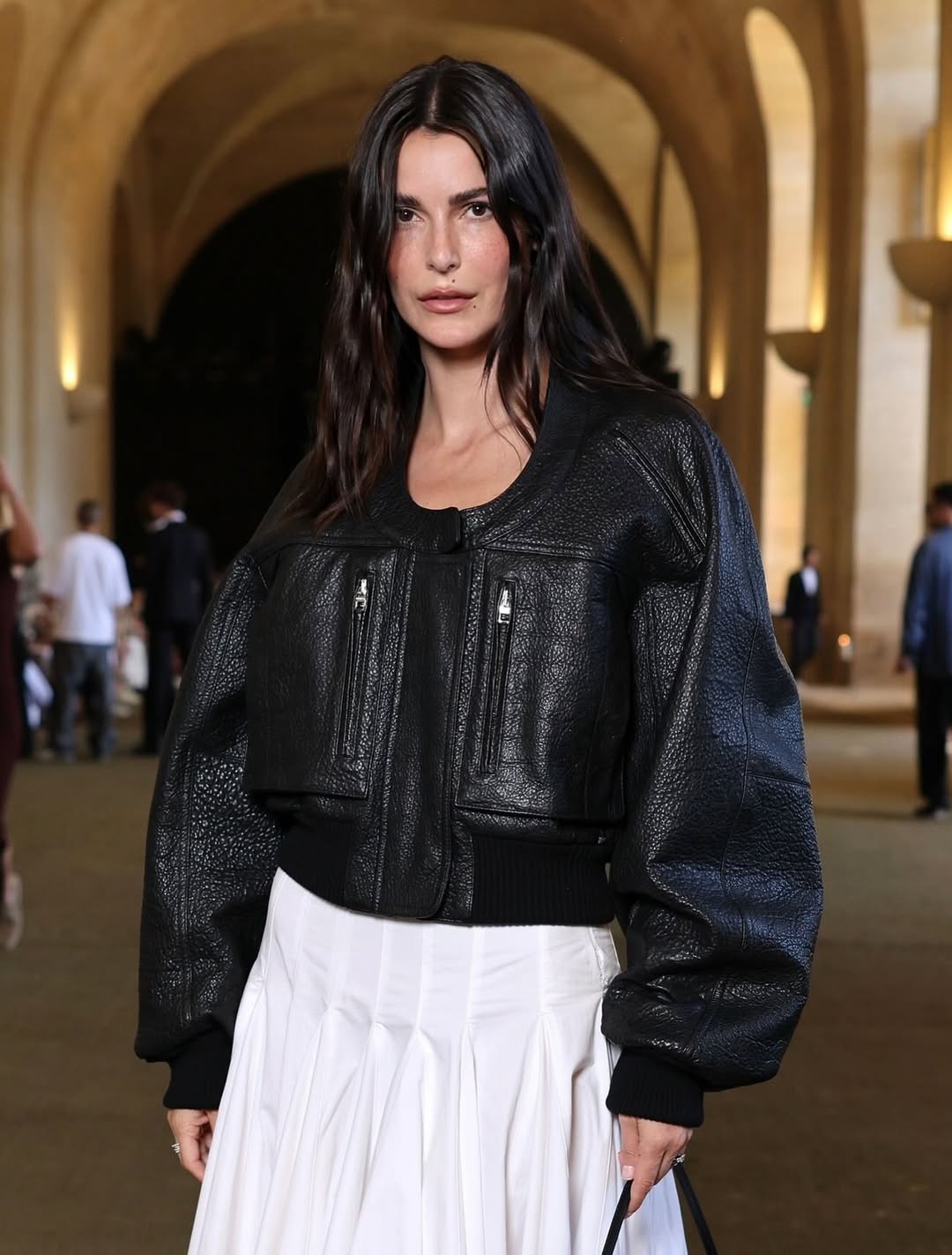 @leiasfez wears an oversized leather bomber