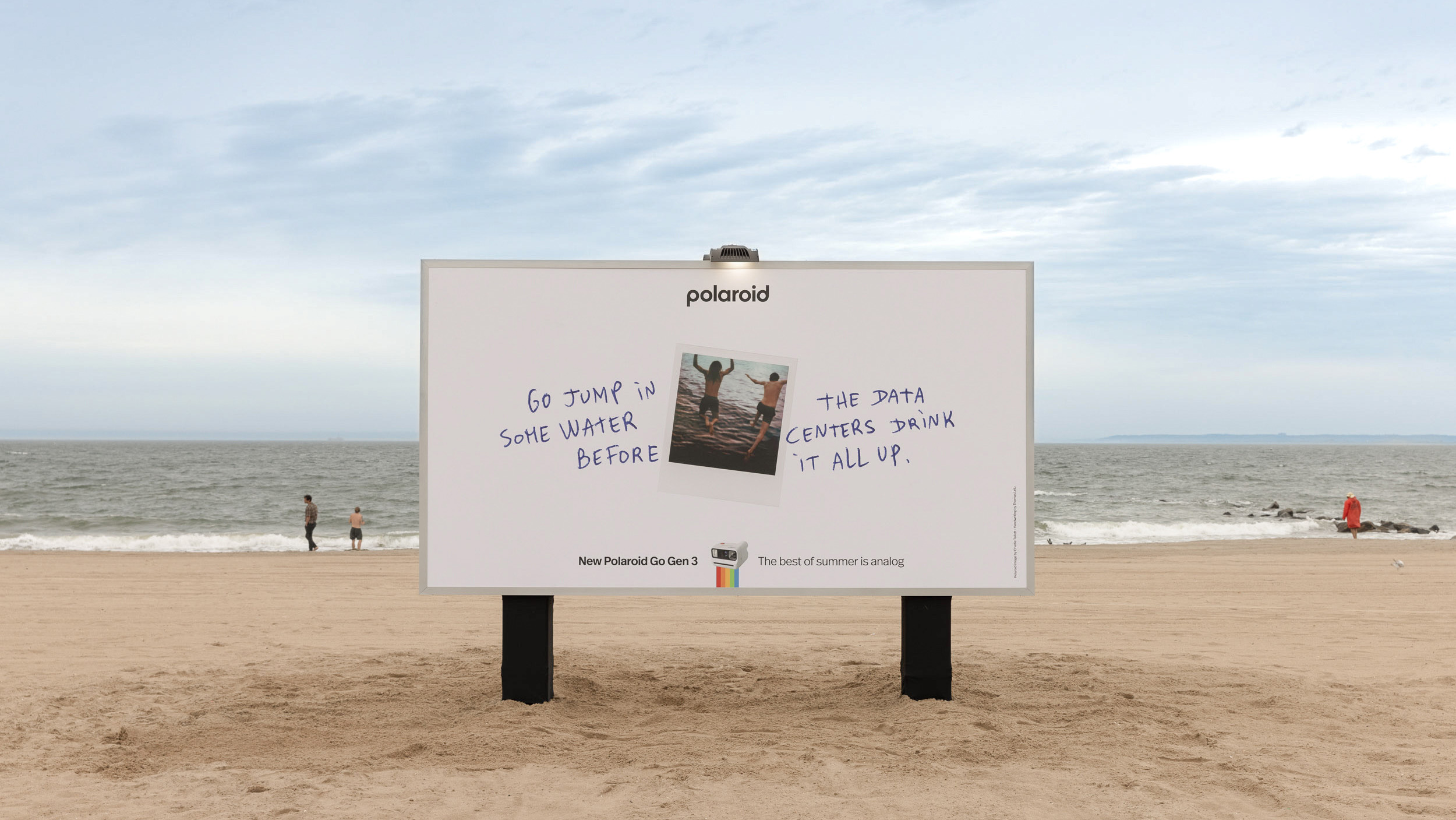 A Polaroid billboard encouraging an analog summer