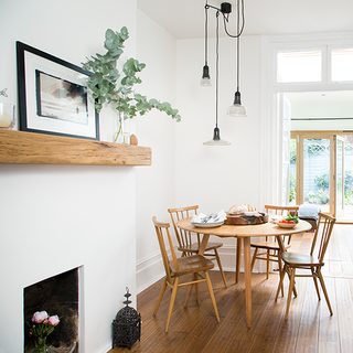 dining area with wooden flooring and wooden dining set