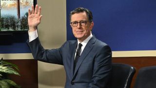Stephen Colbert waving at the audience on The Late Show with Stephen Colbert