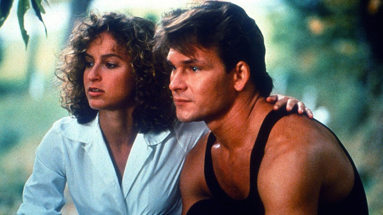 A still from the movie Dirty Dancing showing Patrick Swayze as Johnny Castle and Jennifer Grey as Frances 