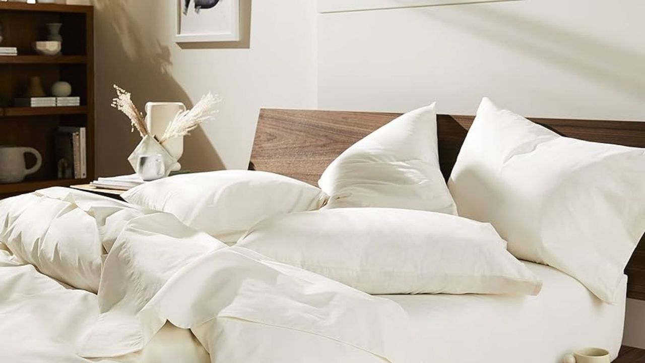 Brooklinen bedding in the Memorial Day bedding sales on a bed against a white wall.