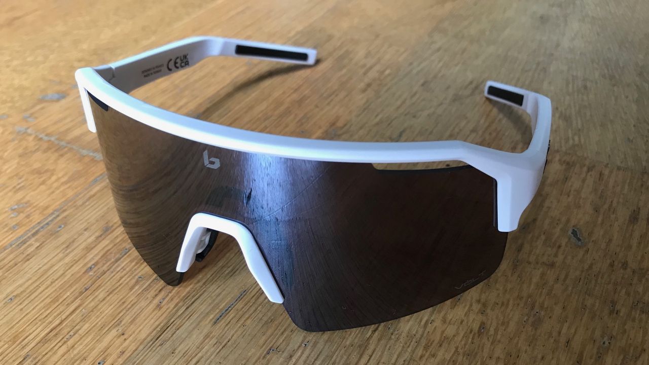 Bolle C-Shifter glasses on a wood background