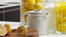 Used lemons on a chopping board after being squeezed on a juicer