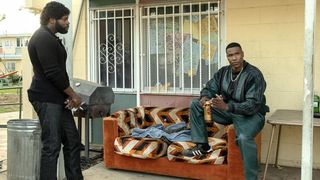 Amin Joseph as Jerome and Quincy Chad as Big Deon by a couch in Snowfall season 6