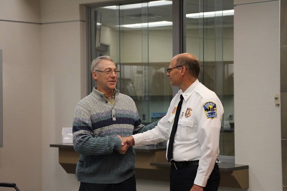 Earl Melchert, left, and Alexandria, MN police chief, Richard Wyffels, right.