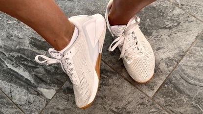 Woman wearing the Reebok Nano X1 cross training shoes, angled