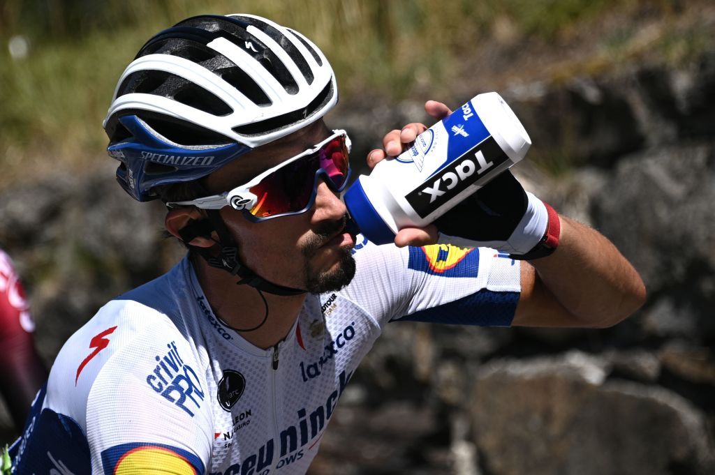 Team Deceuninck rider Frances Julian Alaphilippe drinks as he rides during the fourth stage of the 72nd edition of the Criterium du Dauphine cycling race 153 km between Ugine and Megeve on August 15 2020 Photo by AnneChristine POUJOULAT AFP Photo by ANNECHRISTINE POUJOULATAFP via Getty Images
