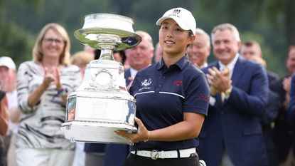 Ruoning Yin with the trophy following her win in the KPMG Women's PGA Championship at Baltusrol