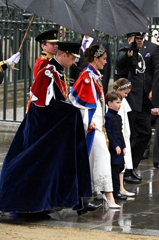 Britain's Prince William, Prince of Wales, Britain's Catherine, Princess of Wales, Britain's Princess Charlotte of Wales and Britain's Prince Louis of Wales arrive at Westminster Abbey in central London on May 6, 2023, ahead of the coronations of Britain's King Charles III and Britain's Camilla, Queen Consort. - The set-piece coronation is the first in Britain in 70 years, and only the second in history to be televised. Charles will be the 40th reigning monarch to be crowned at the central London church since King William I in 1066. Outside the UK, he is also king of 14 other Commonwealth countries, including Australia, Canada and New Zealand. Camilla, his second wife, will be crowned queen alongside him, and be known as Queen Camilla after the ceremony.