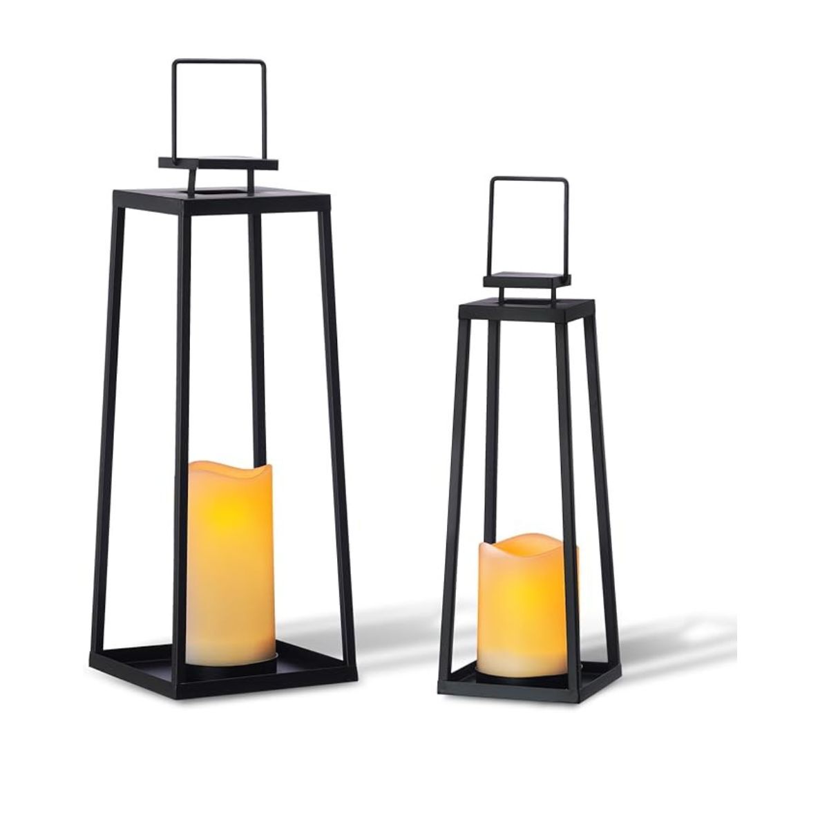 Two black outdoor lanterns with electric candles inside