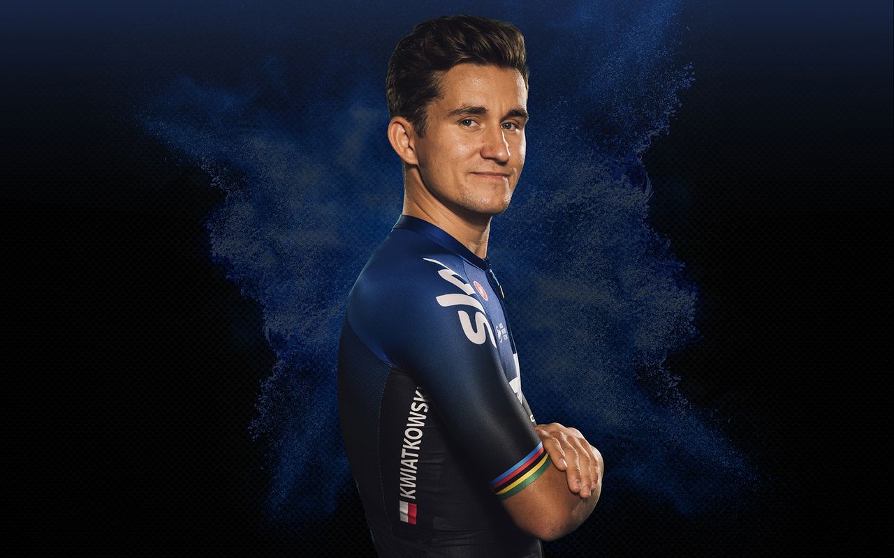 Michal Kwiatkowski's jersey has the rainbow bands of a former world champion