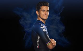Michal Kwiatkowski's jersey has the rainbow bands of a former world champion
