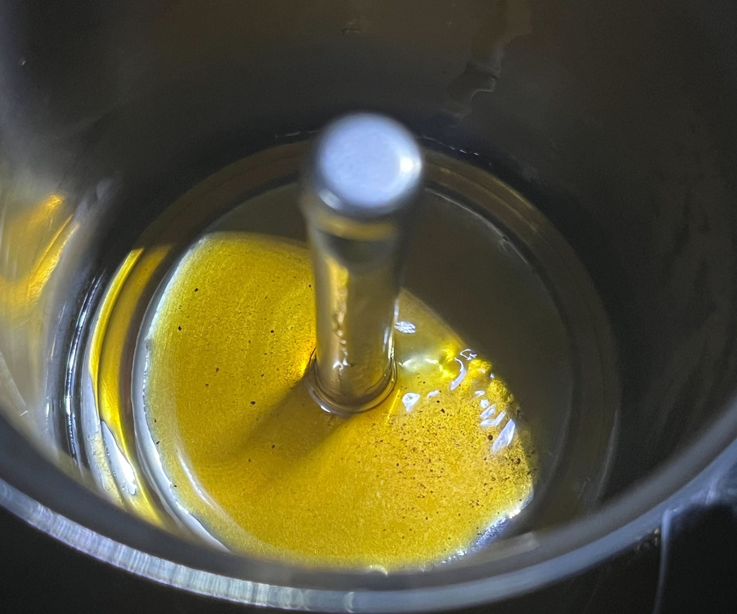 Close up of the fire drips of coffee in the upper section of the stainless steel Bialetti Venus