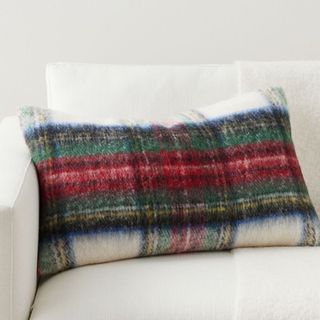 Stewart Plaid Lumbar Pillow on a white sofa. 