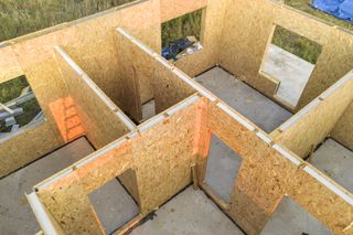 Construction of new and modern modular house. Walls made from composite wooden sip panels with styrofoam insulation inside
