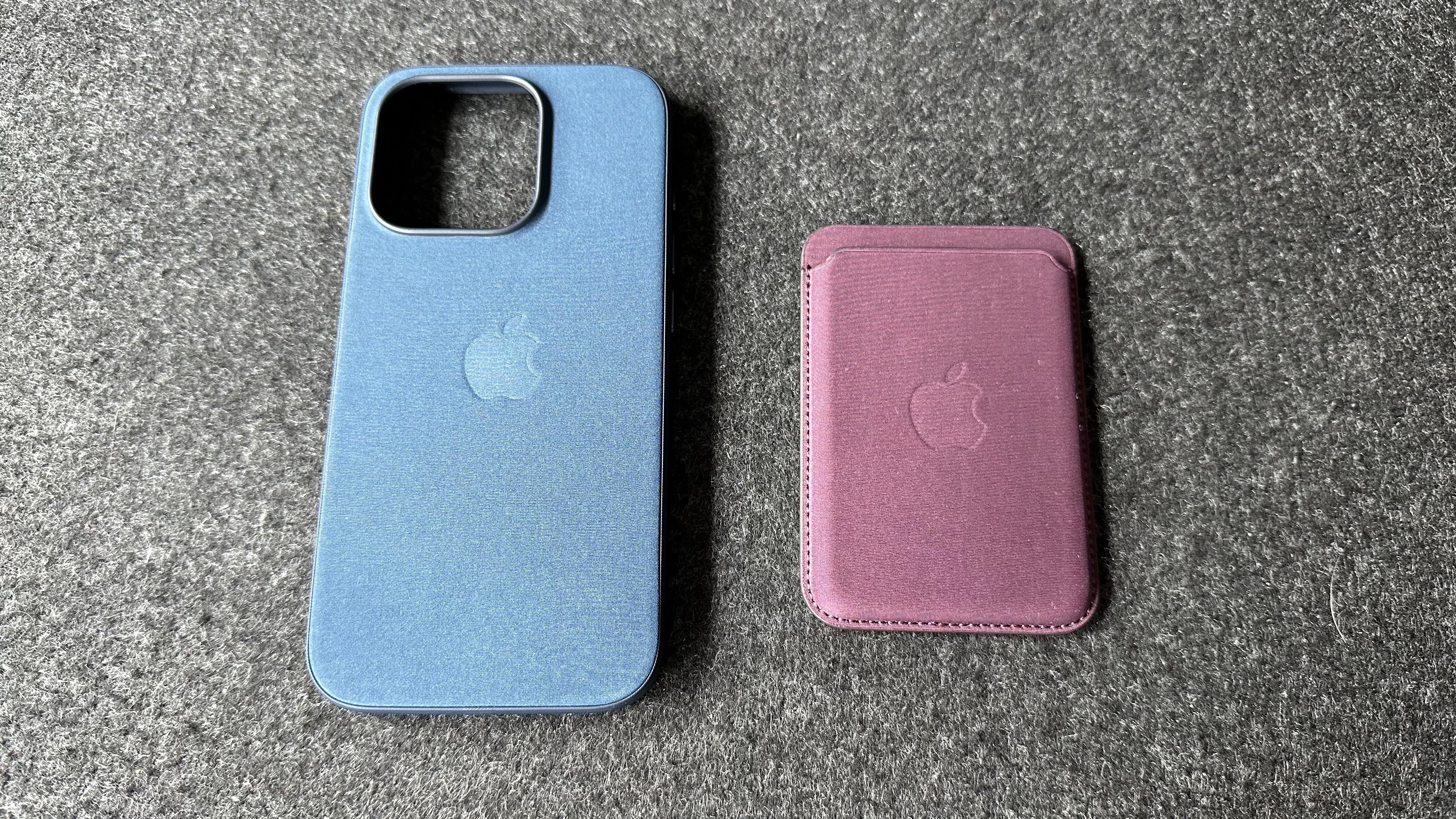 The iPhone 15 Pro with a Pacific Blue Apple FineWoven case on.