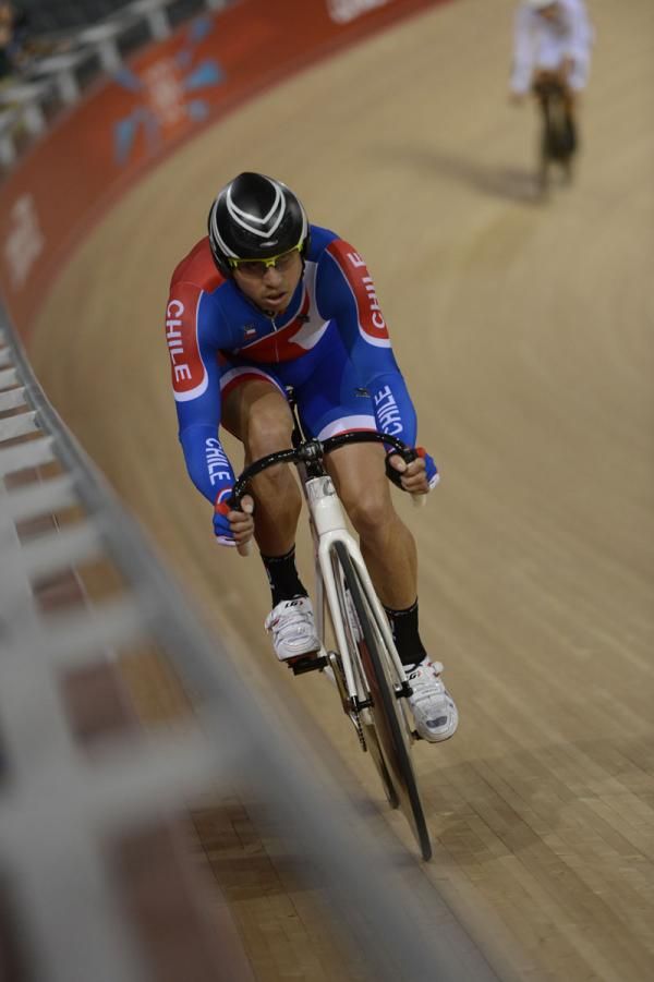 A track rider from Chile trains on the banking of the London velodrome