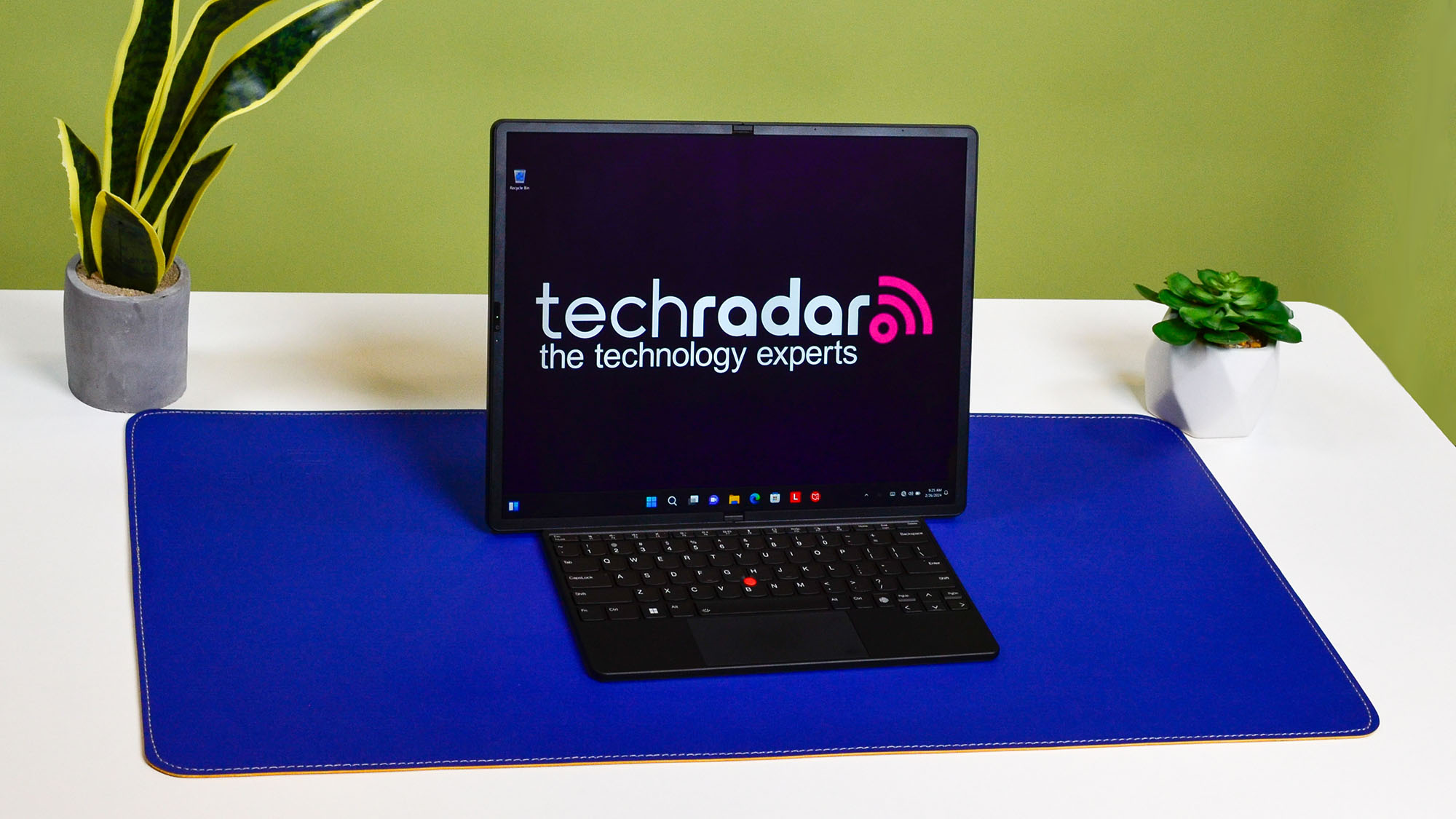 A Lenovo ThinkPad X1 Fold 16 Gen 1 on a white desk