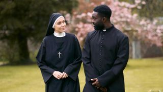 Anna (Keeley Hawes) and Catholic priest David (Paapa Essiedu) in Falling