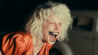 Jessie Buckley yelling in distress in The Bride