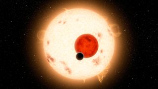 An artist's rendering of Kepler 16-b and its two suns