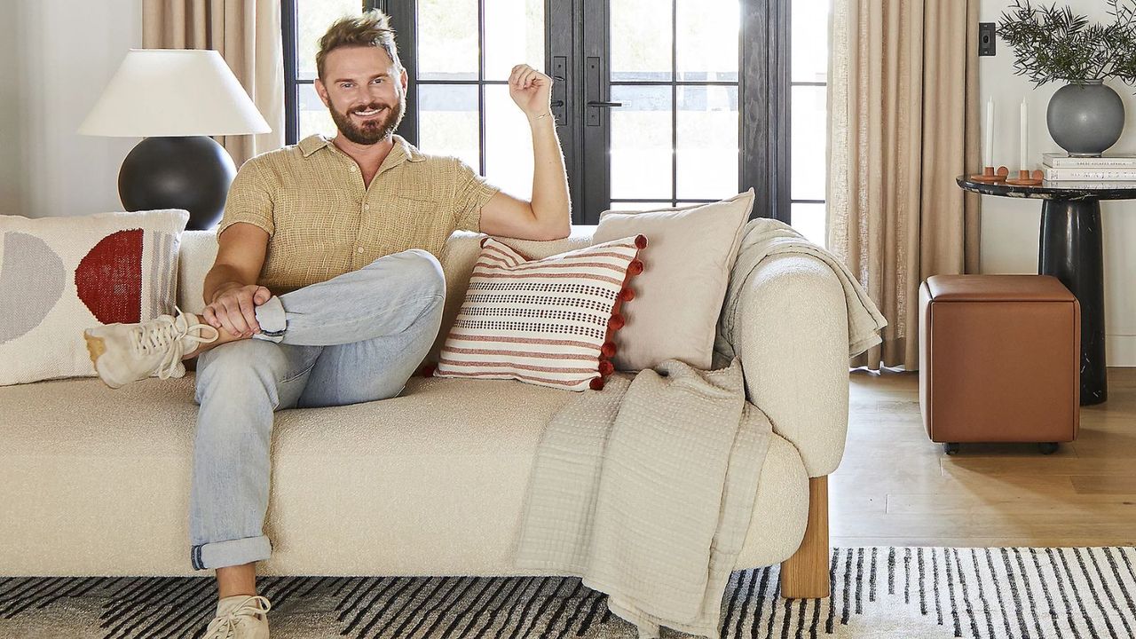 An image of Queer Eye interior designer Bobby Berk next to his home decor range for QVC