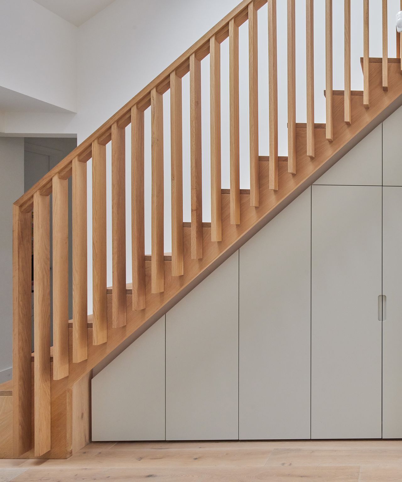 A new staircase with built in storage underneath