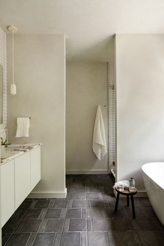 A bathroom with a privacy wall