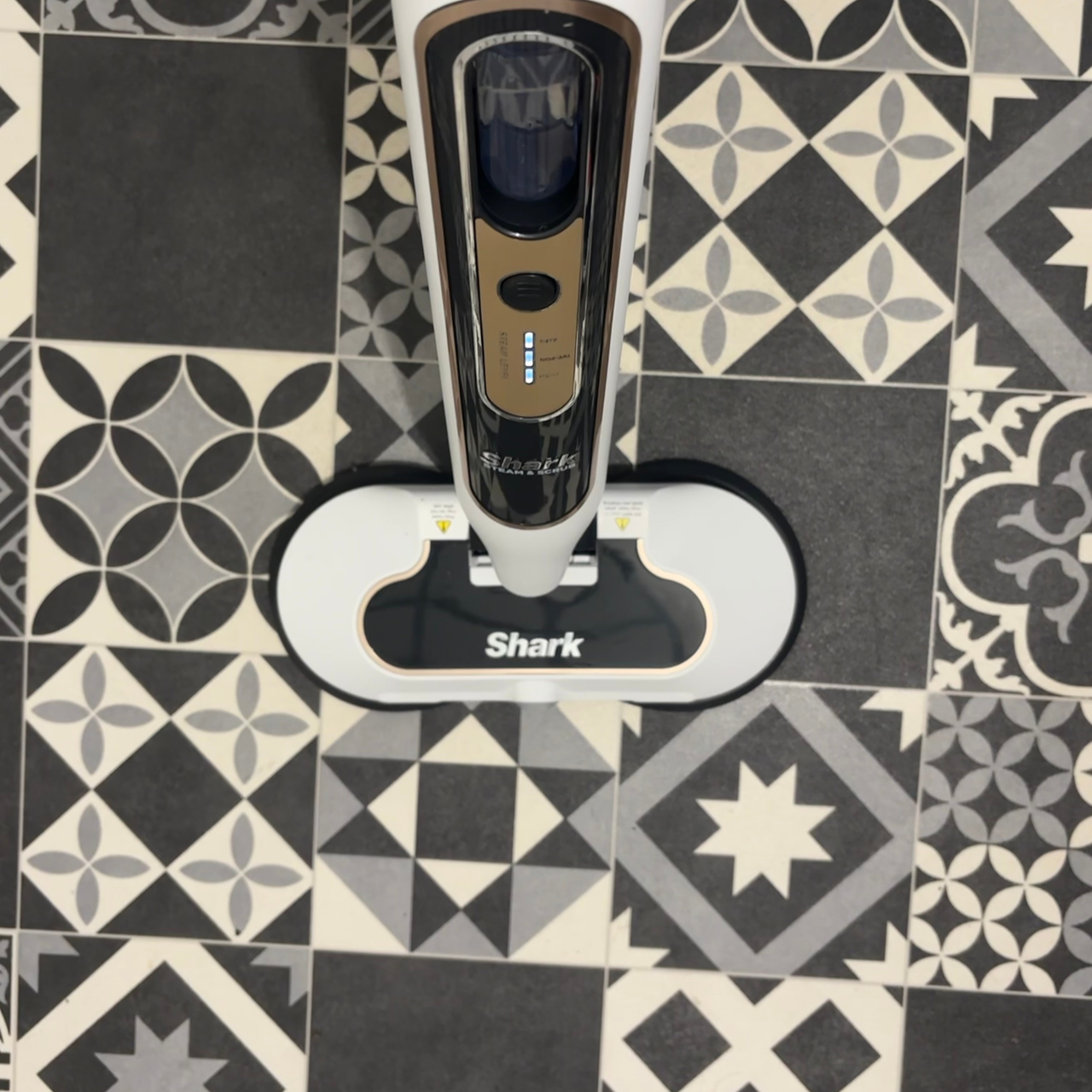 Shark Steam &amp; Scrub Automatic placed on patterned vinyl tiles
