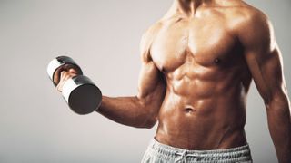 a photo of a man with strong arms holding a dumbbell