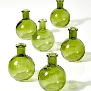 Six green mini glass vases