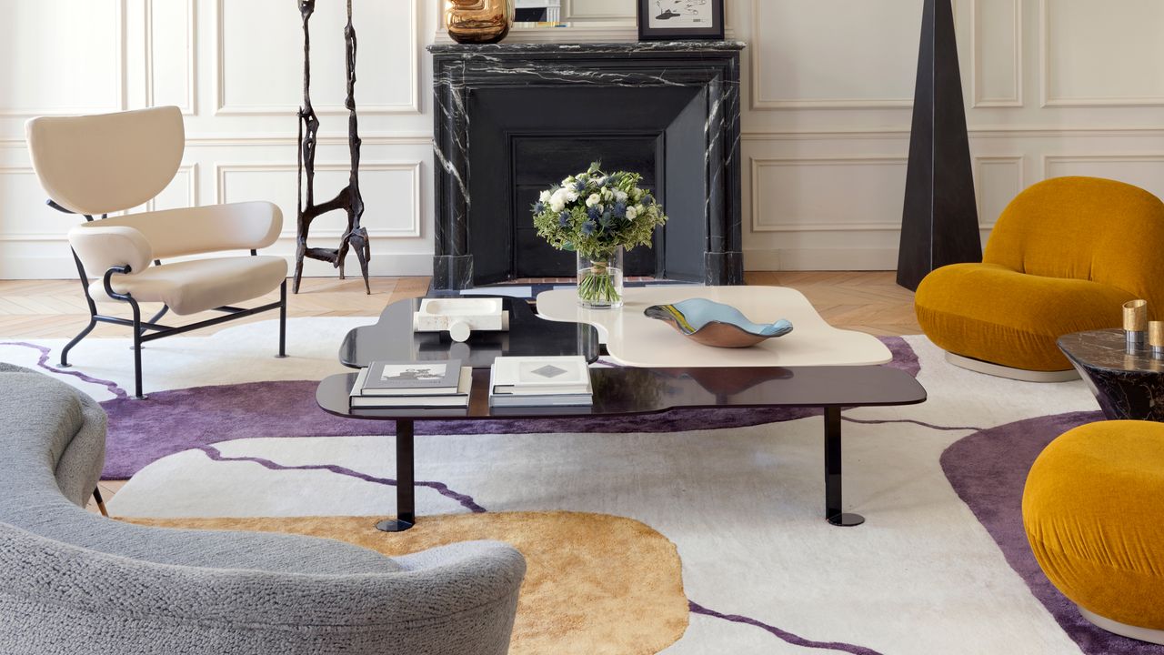 a living room with purple and yellow accents