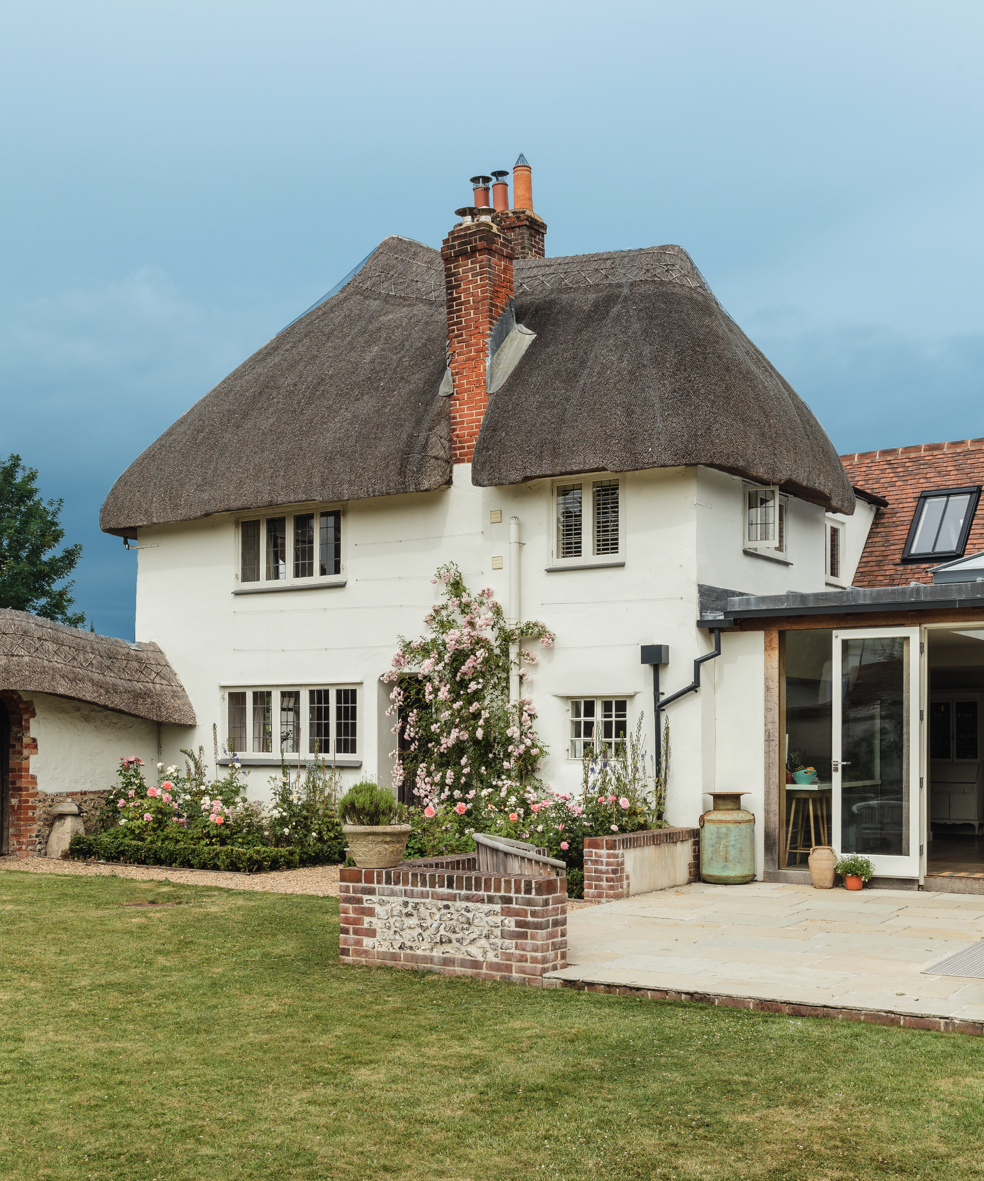thatched cream rendered cottage