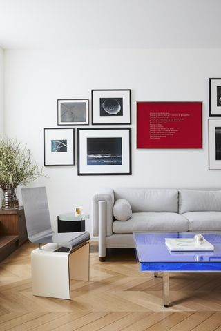 White living room with colorful gallery wall