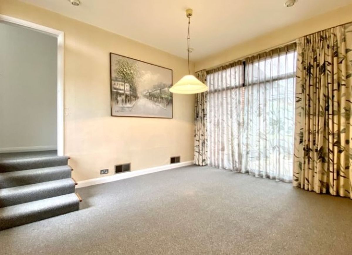 Games room with large windows draped with curtains