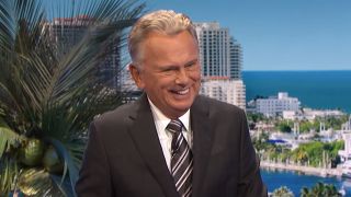 Pat Sajak laughing on Wheel of Fortune