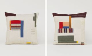 Two white cushions with patches of different coloured and textured fabrics