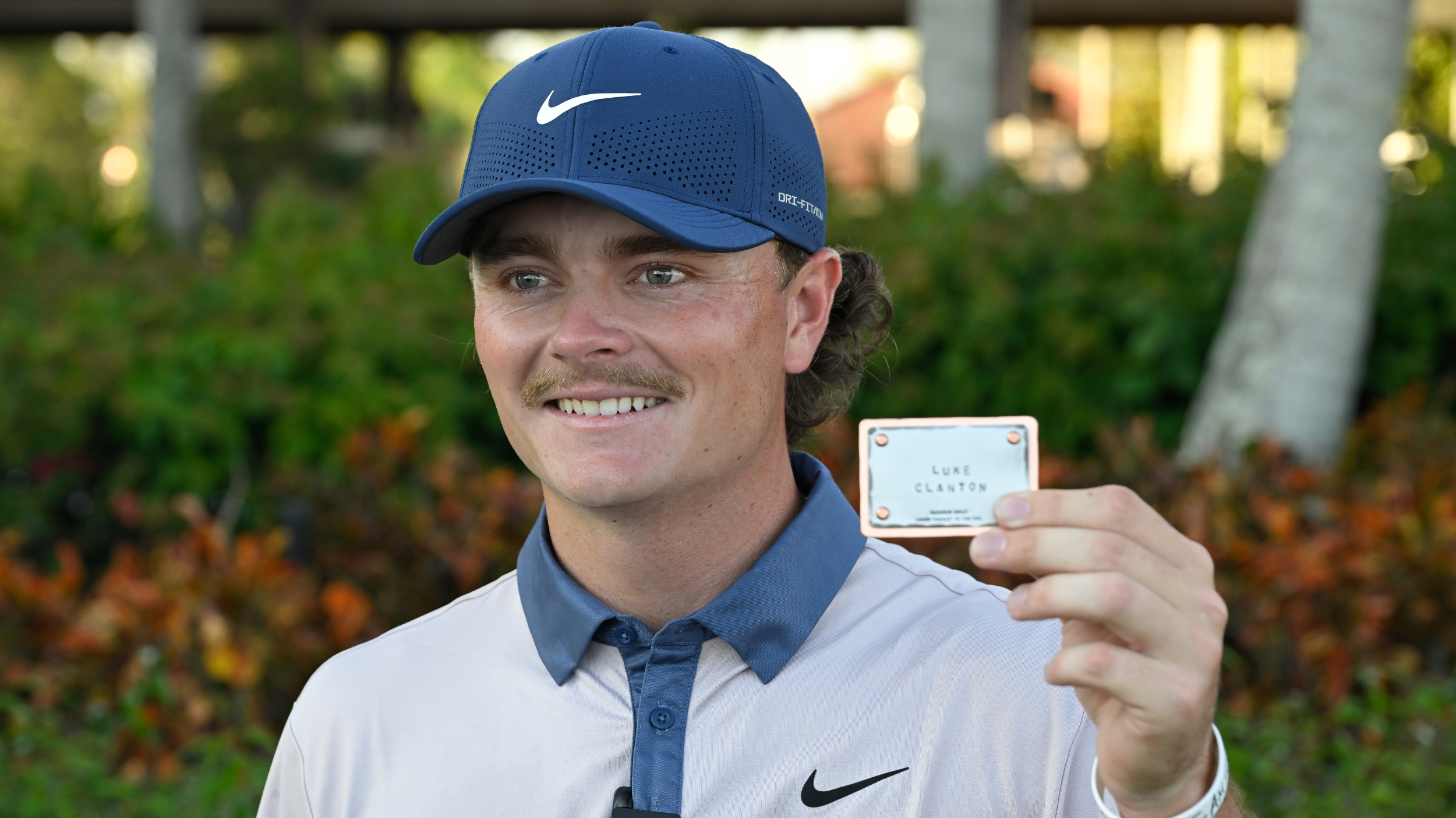 Luke Clanton poses for a photo with his PGA Tour card
