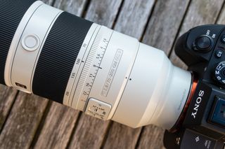 The Sony FE 70-200mm F2.8 GM OSS II lens on a wooden table