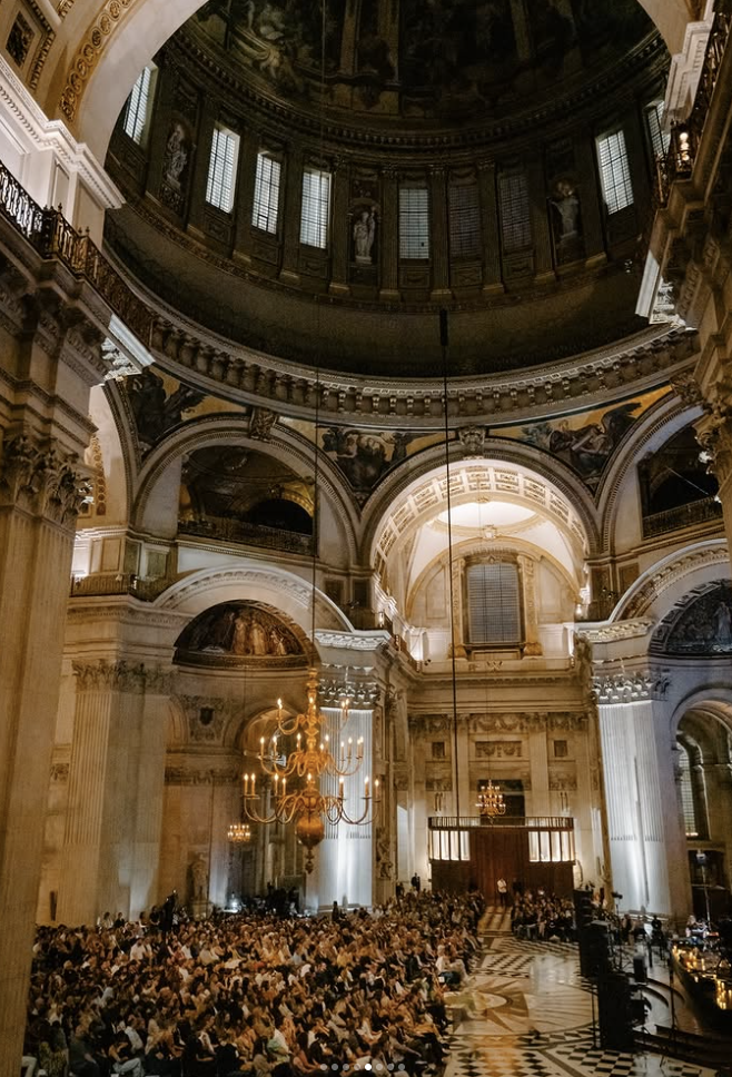 an image of St Paul's Cathedral during a candle lit performance by Patti Smith in 2025, hosted by Fabric