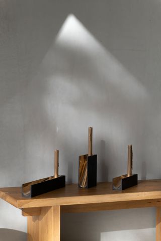Noe Duchafour Lawrance candles with bronze candleholders