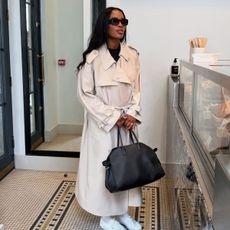 An image of @nlmarilyn wearing white summer trainers.