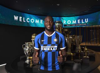 Romelu Lukaku poses after signing for Inter in 2019.