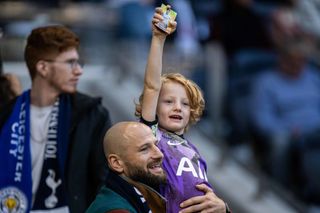 Father and son holding Premier League Panini collectors card with image of Son Heung-min of Tottenham Hotspur during the Premier League match between Tottenham Hotspur and Leicester City at Tottenham Hotspur Stadium on September 17, 2022 in London, United Kingdom