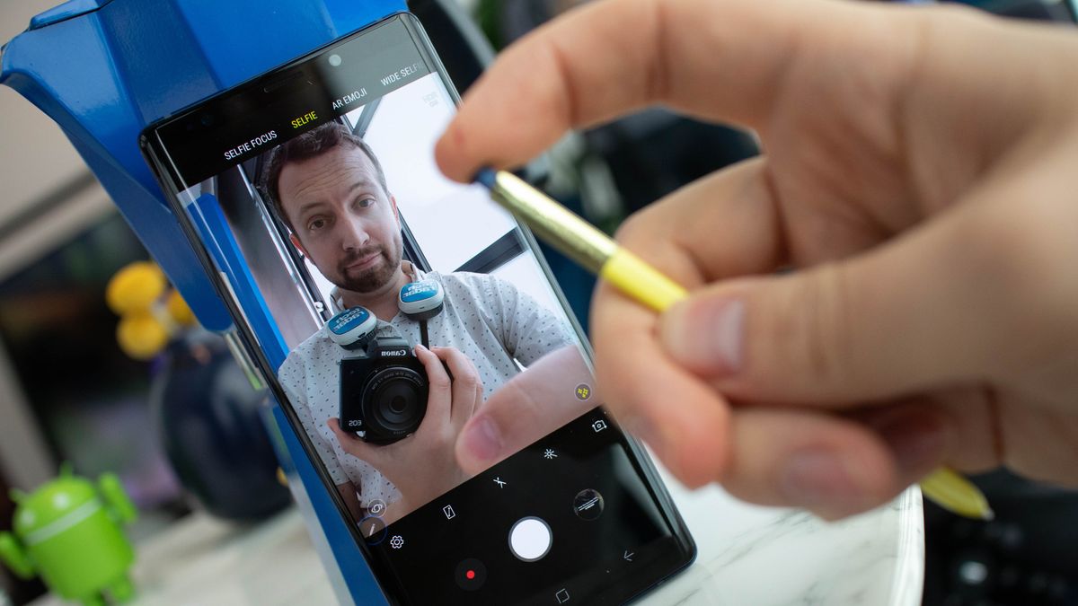 A long press of the S Pen button launches the camera app