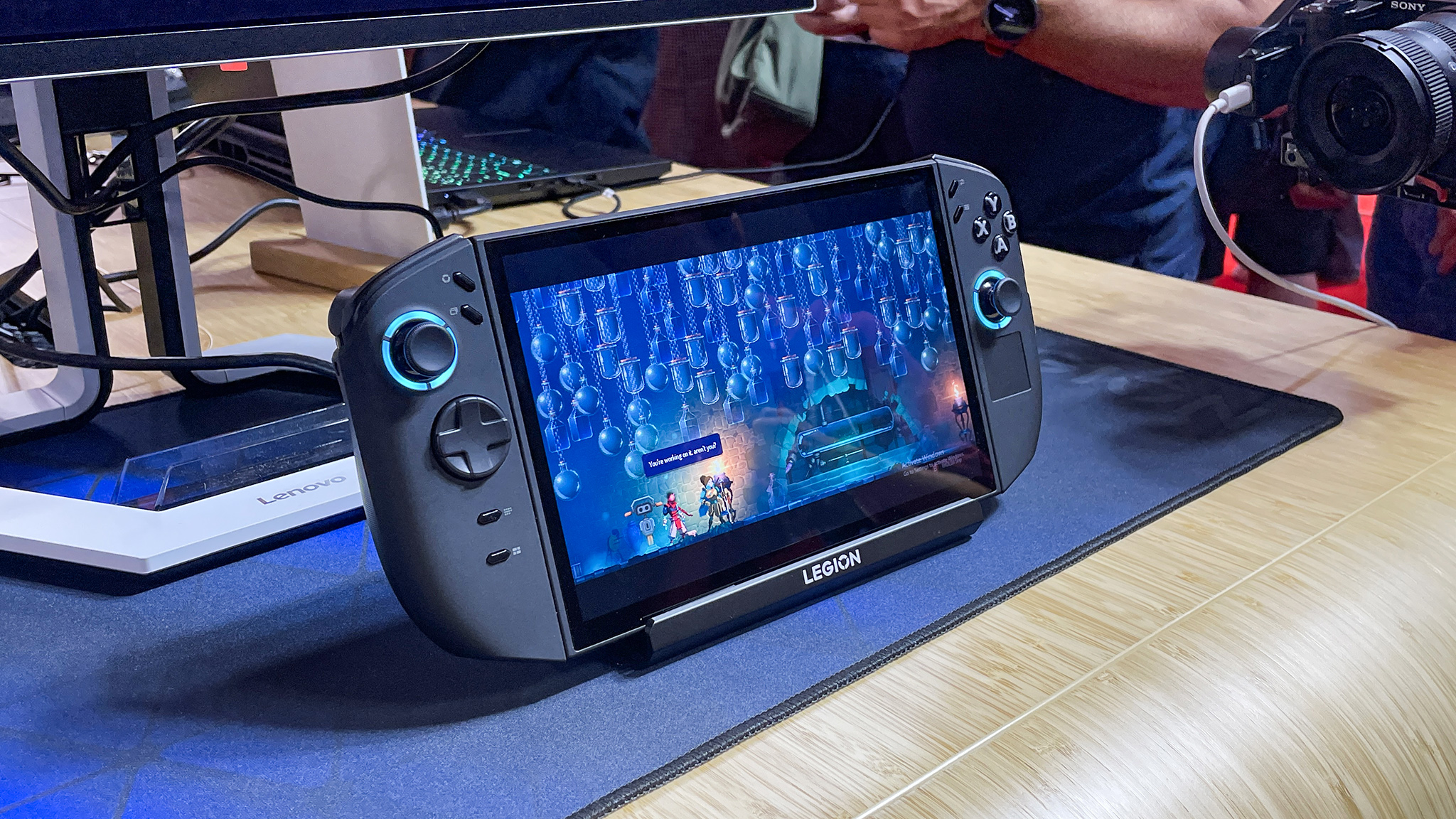 The Lenovo Legion Go 2 on a desk and displaying a game. 