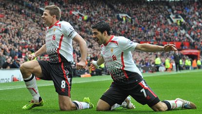 Gerrard and Suarez celebrate during Liverpool's win at Man United
