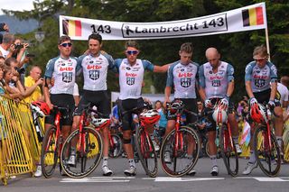 Lotto Soudal line across the finish line of stage 4 for a moment of silence in memory of their teammate Bjorg Lambrecht
