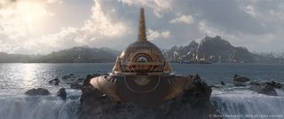 Whiskytree VFX; a shot from Marvel Ragnarok of a golden domed building on a waterfall
